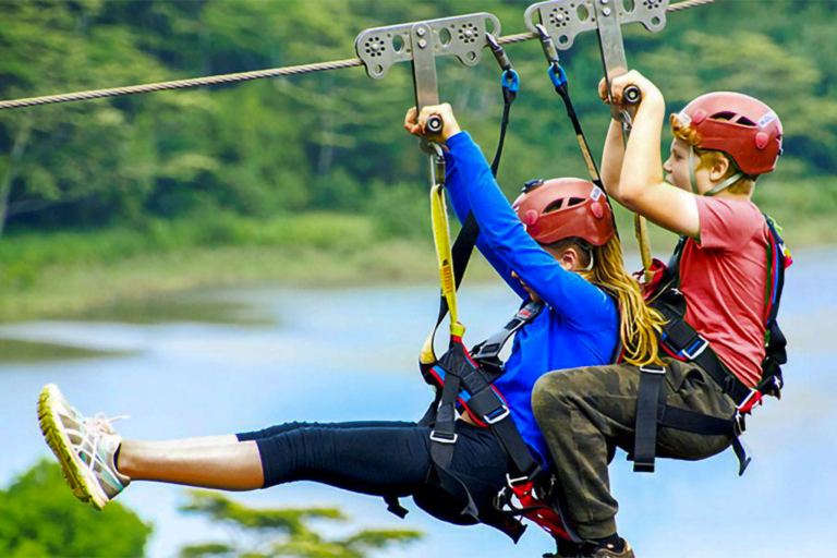 Two Kids In Tandem Zipping Koloa Zipline 