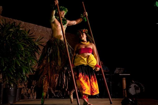 Luau dancer on stilts