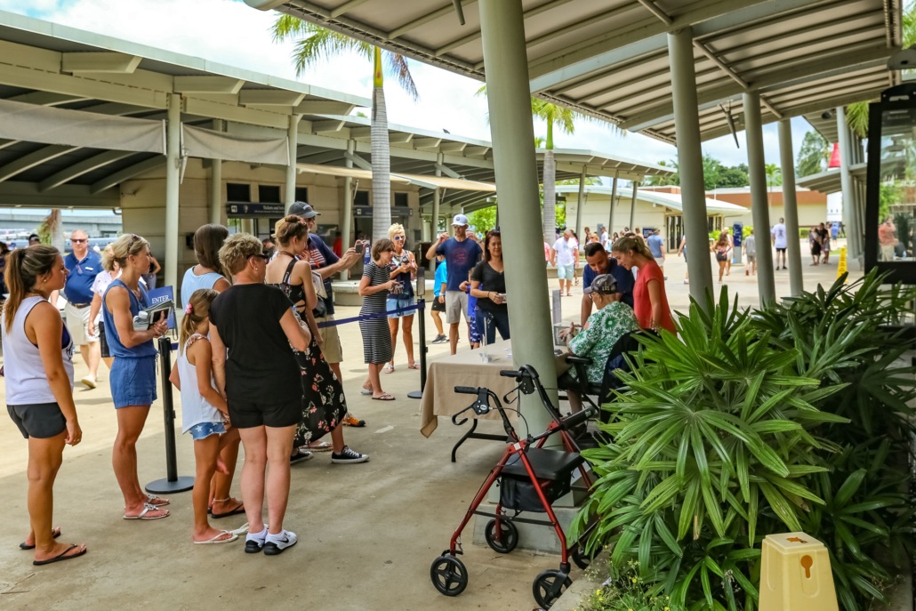 Visitors with Veteran at Pearl Harbor Visitor Center Oahu