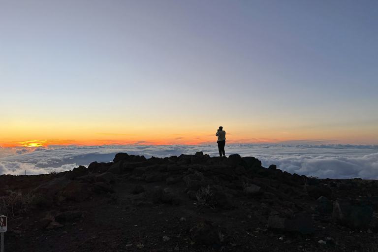 man taking photo at sunset on haleakala