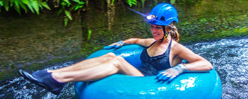 a girl on kauai float tubing kauai back country adventure