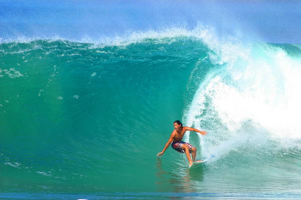 Surfer on large wave Oahu