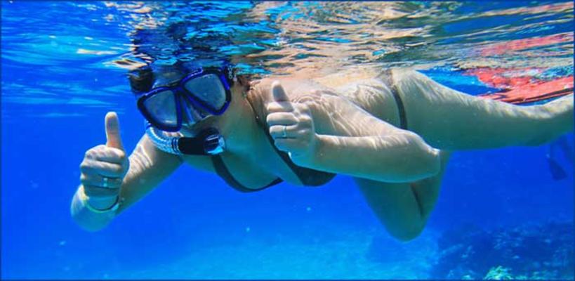 Island of Lanai Hawaii Snorkeling tour woman swimming