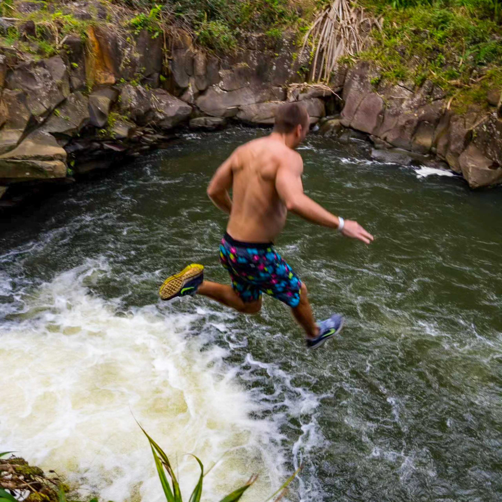Hikemaui Maui Waterfall Rainforest Hike Guest Jumping From Waterfall