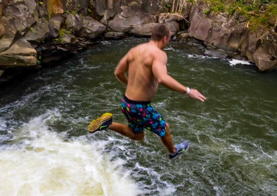 Hikemaui Maui Waterfall Rainforest Hike Guest Jumping From Waterfall Slider