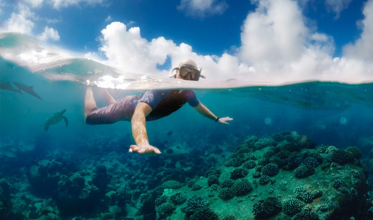 snorkeling off of a boat in hawaii