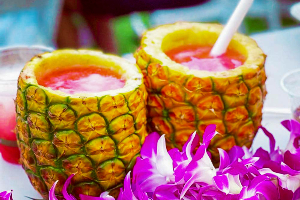 Enjoying A Tropical Cocktail Out Of A Fresh Pineapple Ka Moana Lua 