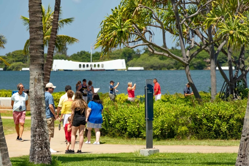 Pearl Harbor Visitors with Arizona Memorial Background Oahu