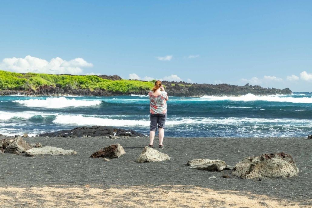 Punalu'u Black Sand Beach Visitor and Waves Big Island