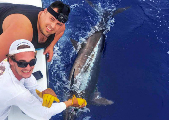 Biteme Kona Coast Private Fishing Trips Slider Two Mans Take A Photo