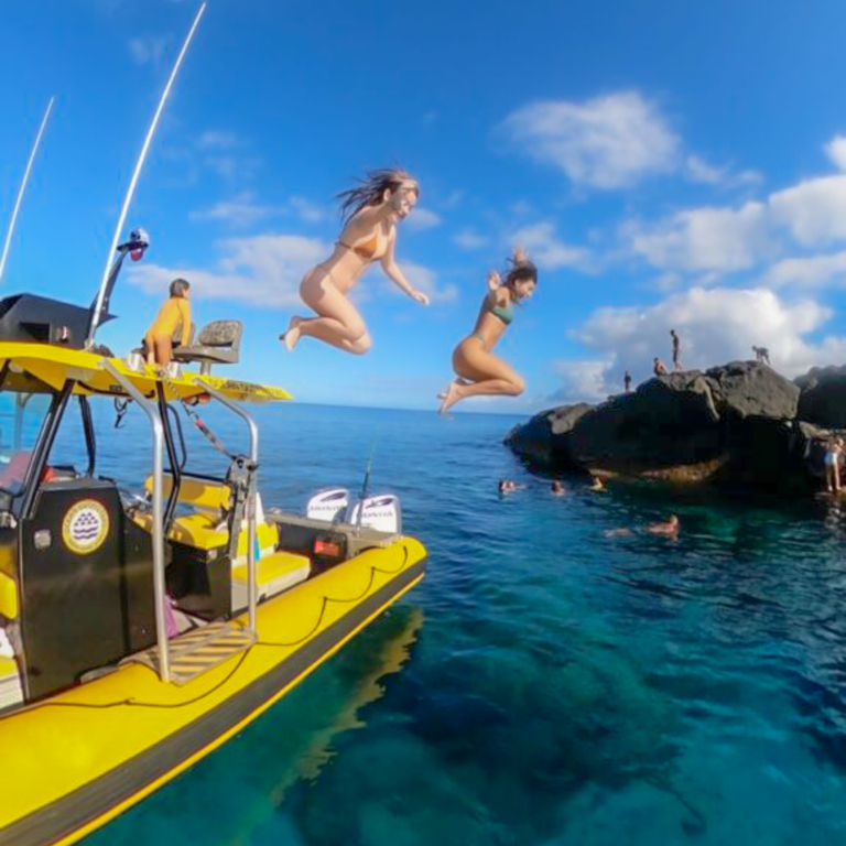 Oceanoutfittershawaii North Shore Summer Snorkel Raft Tour Girl Jimping From Boat