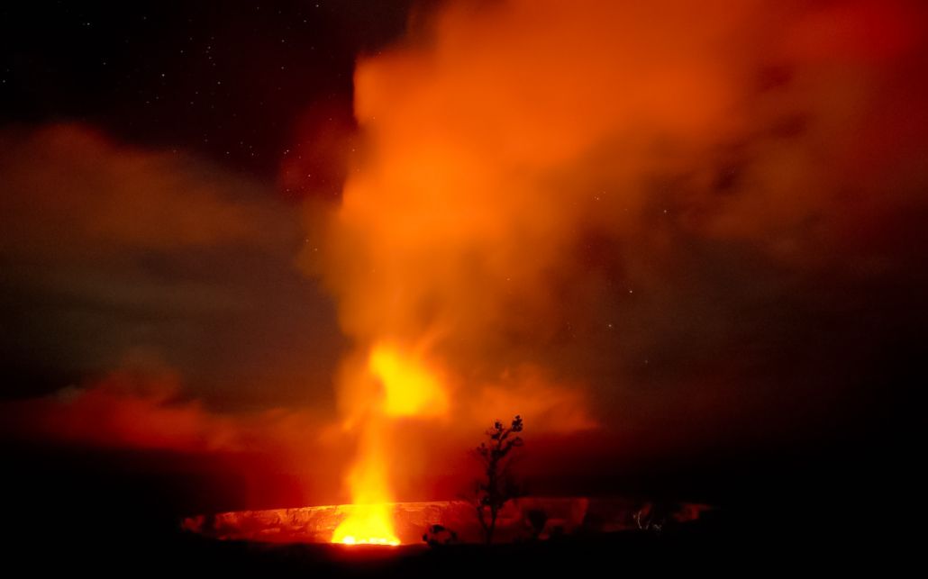the incredible sight of the lava flowing and the volcanos crater glowing in the dark big island