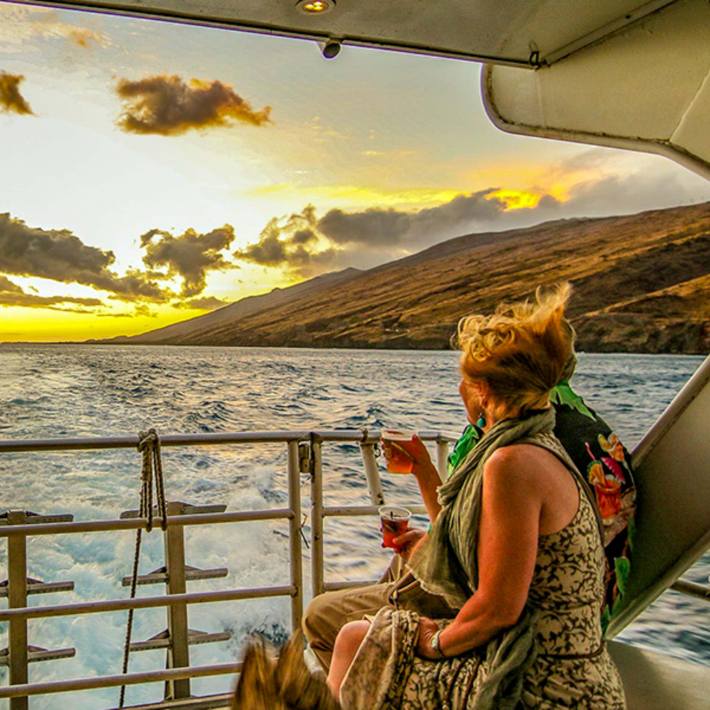 Hawaiinautical West Oahu Sunset Cruise Woman Sitting On Back Of Boat