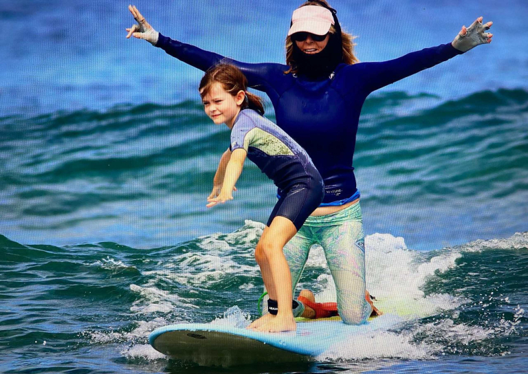 Northshoresurfgirls Group Surf Lessons In Haleiwa Slide Kid And Teacher