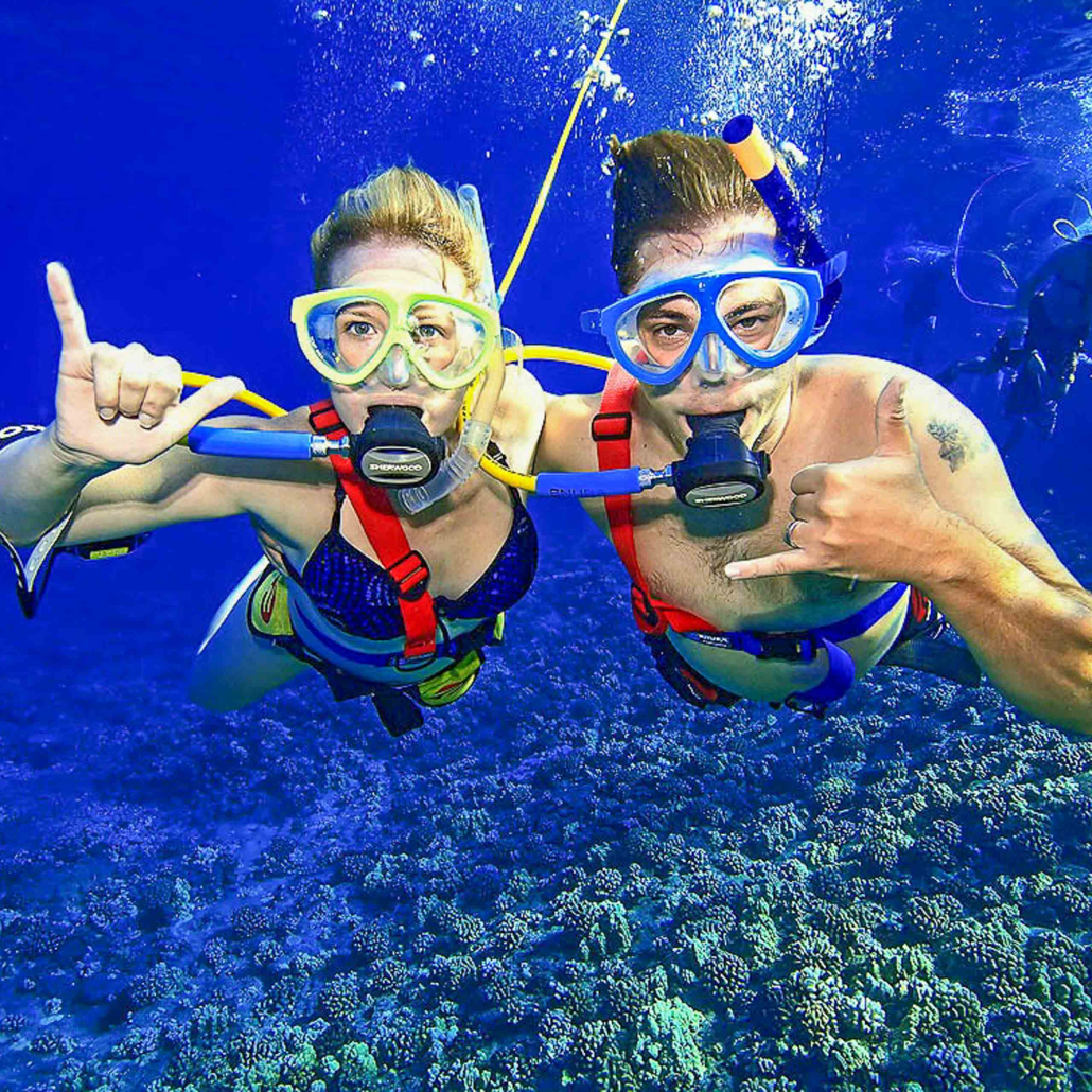 Young Couple Snorkelling At Morning Molokini Adventure 