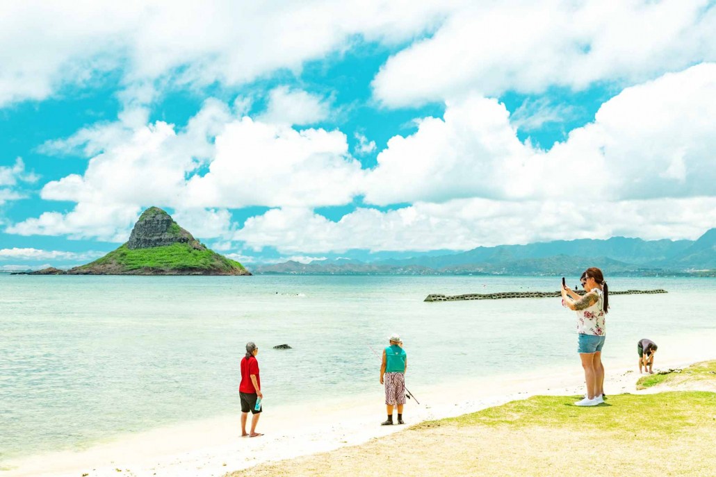 kualoa beach park chinamans hat beach and visitors oahu hawaii