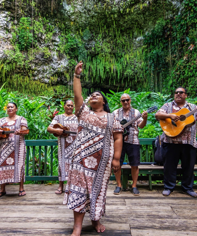 local folk band performs on stage in front of fern grotto shutterstock