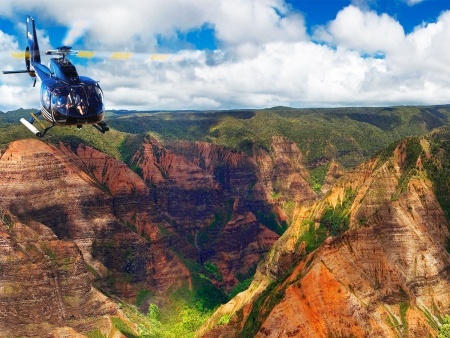 fying above waimea canyon kauai sunshine helicopter