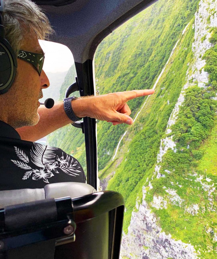 pilot shaylan pointing out the goats on molokai on the doors off tour air maui helicopter tour