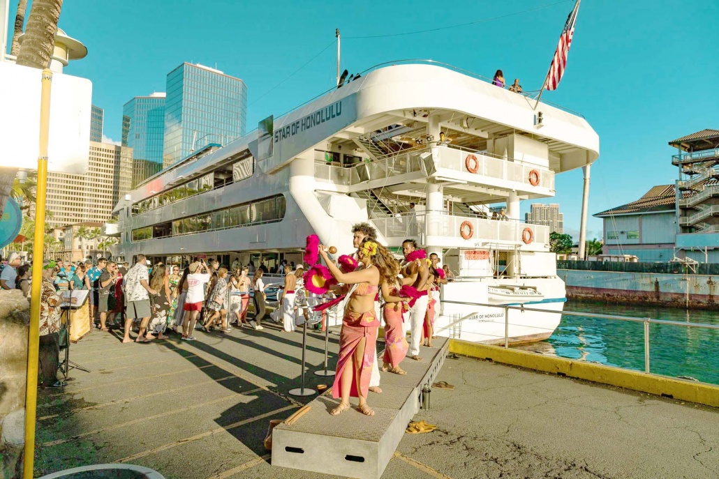 star of honolulu boat hula dancers and guests at dock boarding oahu hawaii
