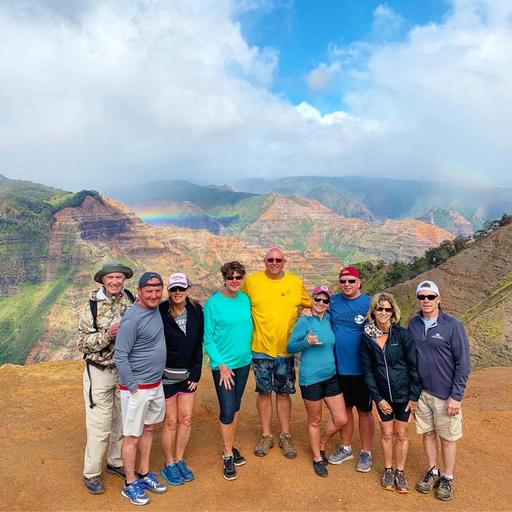 hikers and the beautiful view of waimea canyon kauai hiking tours