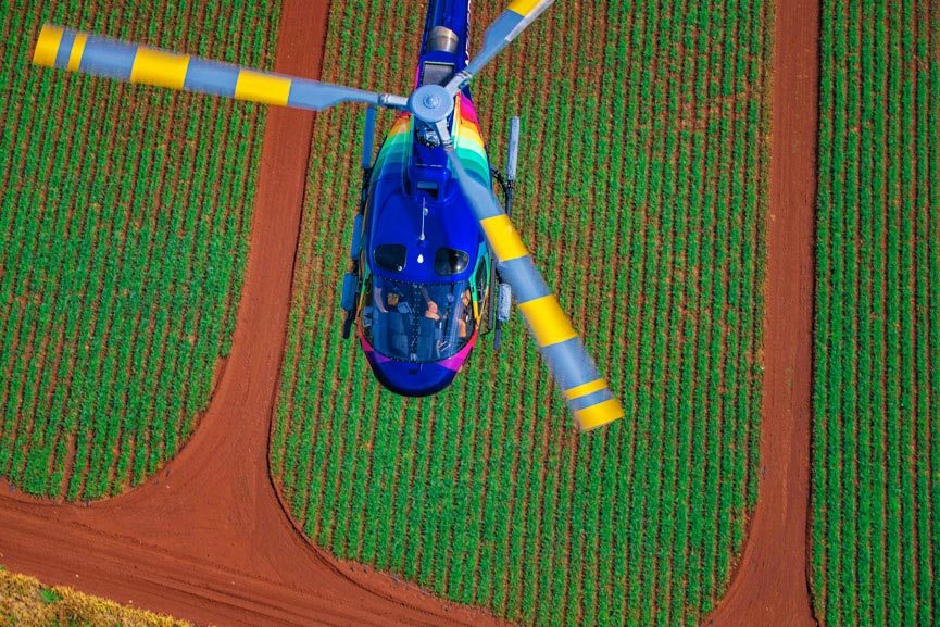 rainbow helicopters astar flying above oahu farmland