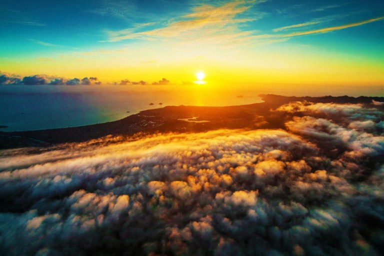 stunning sunset view oahu beach rainbow helicopters