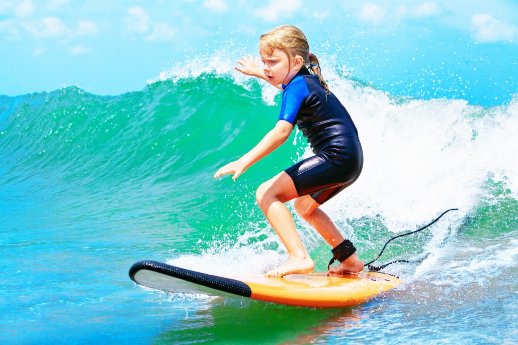 young surfer ride on surfboard with fun on sea waves maui