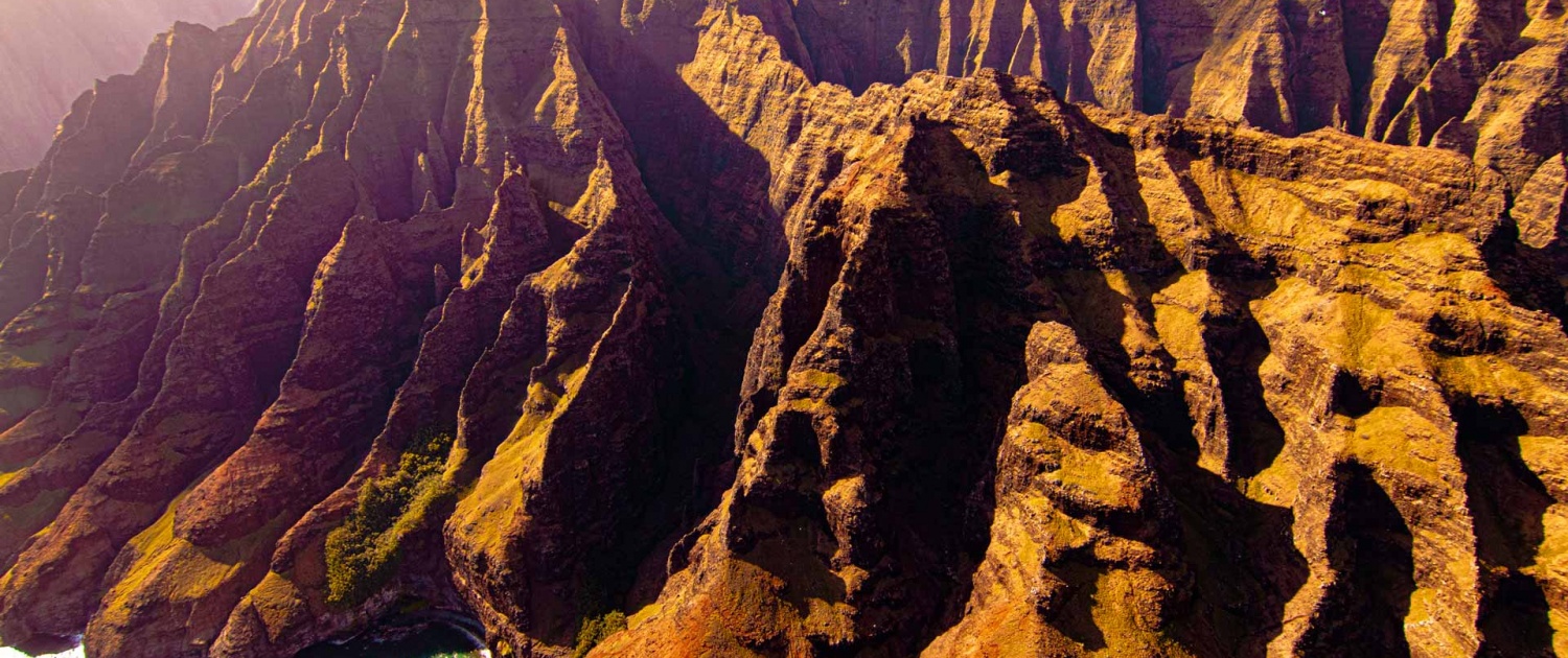a serene stretch of coastline with towering sea cliffs of na pali coast kauai