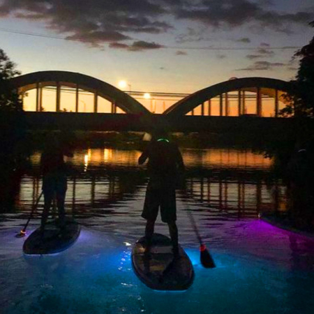 Paddling On The Water As The Sun Sets Product