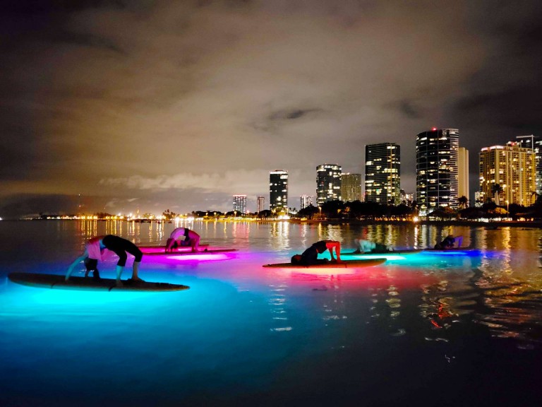 light up the night yoga combining sup and yoga gives you a full body workout