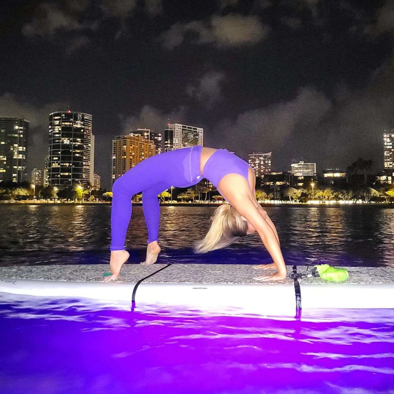 light up the night yoga waikiki doing some gentle yoga stretches