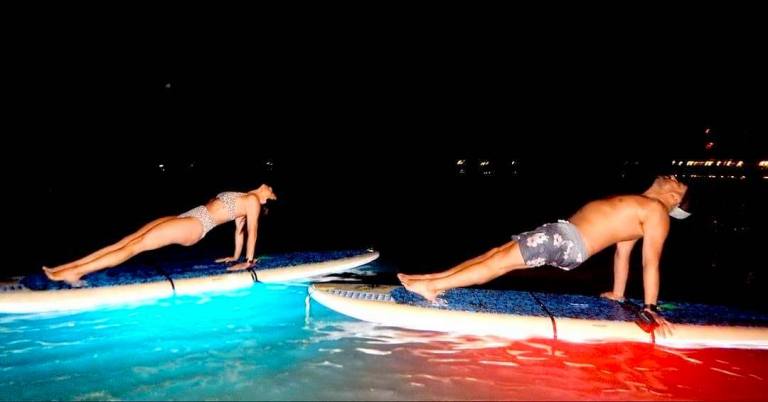 light up the night yoga with friend waikiki