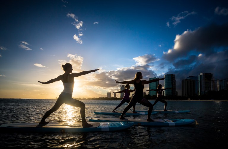 yoga floats waikiki sup lesson oahu rex maximilian warrior