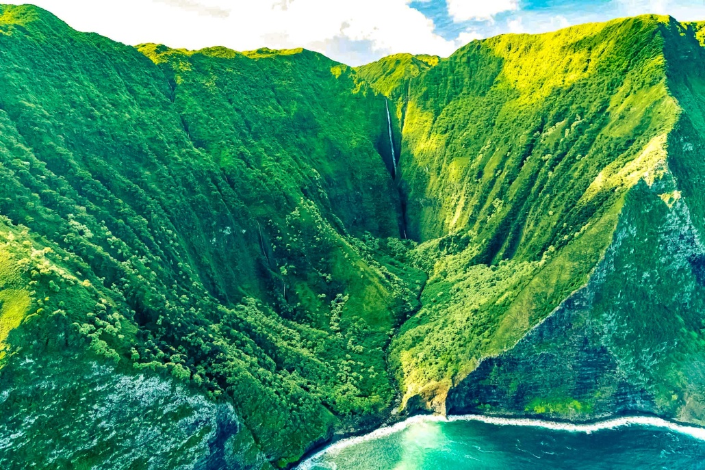 the majestic waterfalls and verdant rainforests of molokai maui helicopter tour hta