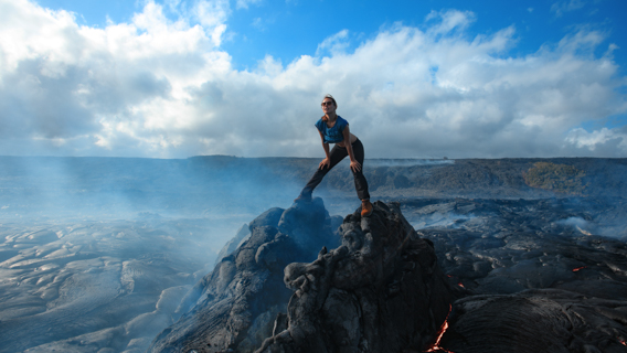 Woman Standing On Rocks Kilaulea Big Island