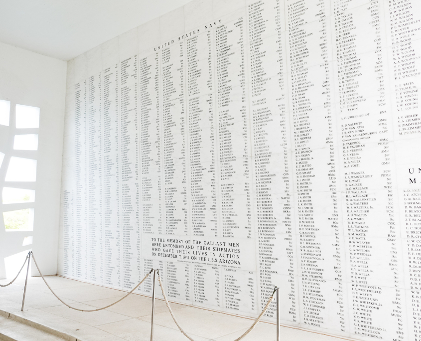 Marble wall of names inside the USS Arizona Memorial at Pearl Harbor honoring fallen sailors and Marines