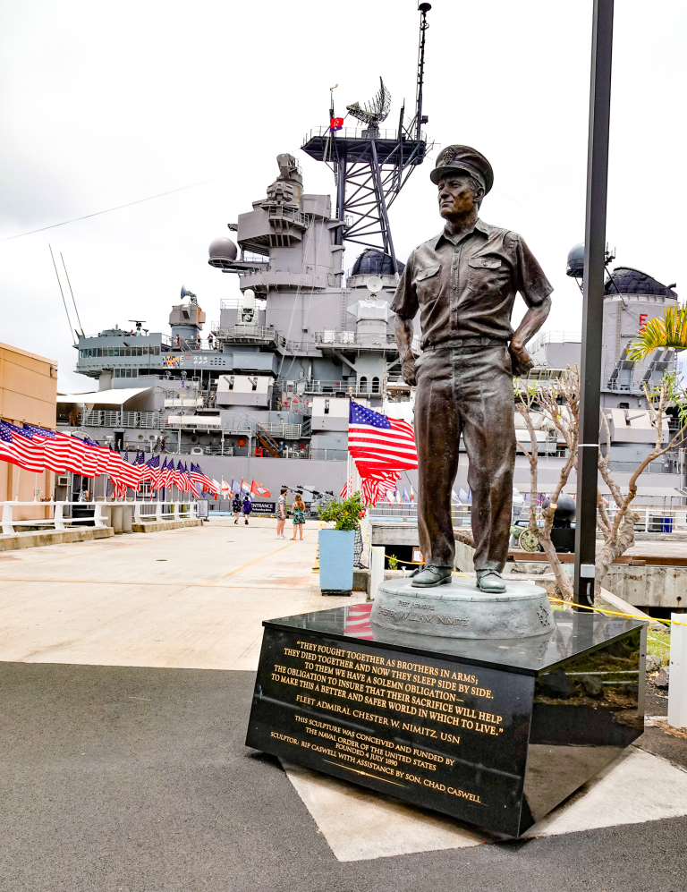 battleship-uss-missouri-pearl-harbor-hawaii-tours Statue of Fleet Admiral Chester W. Nimitz in front of the Battleship USS Missouri at Pearl Harbor, Hawai‘i.