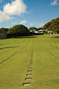 Rows of graves at Punchbowl National Memorial Cemetery of the Pacific in Oahu Hawaii