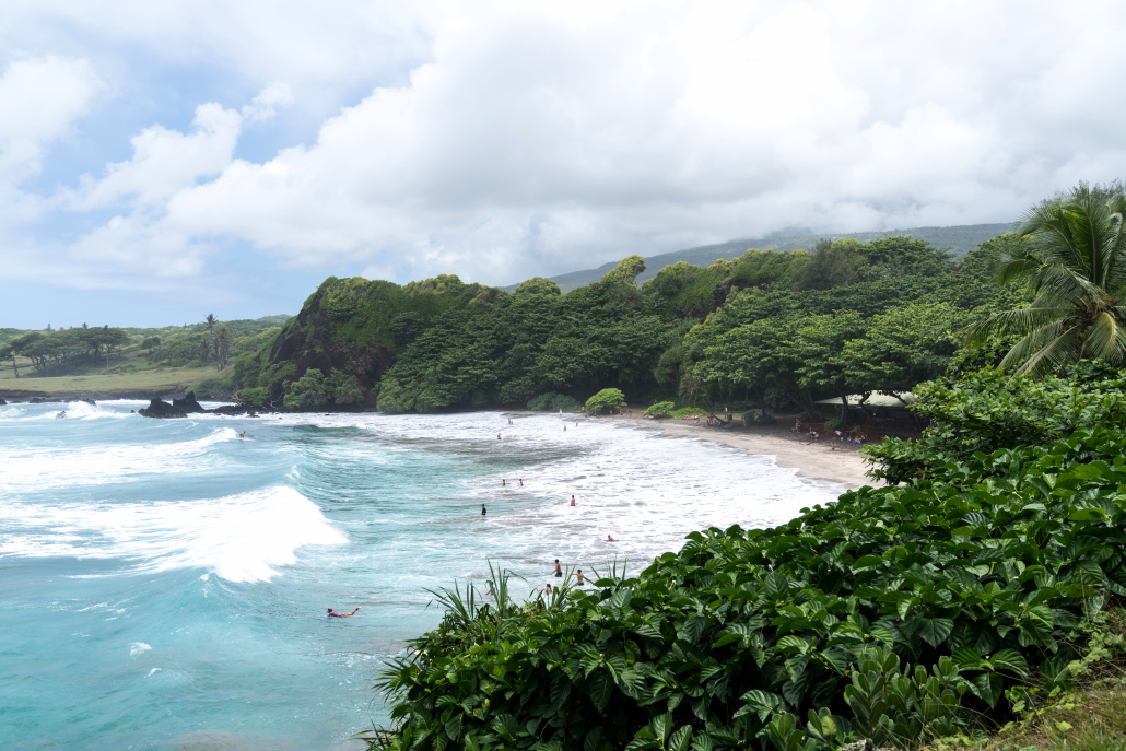 Paradise found on Hāmoa Beach, Hana, Maui, Hawaii Beautiful Hāmoa Beach in Hāna, Maui with golden sand, turquoise waves, and lush tropical surroundings.