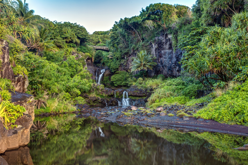 Oheʻo Gulch - Seven Sacred Pools on the Road to Hāna, Maui Oheʻo Gulch, also known as Seven Sacred Pools, on the Road to Hāna in Maui with cascading waterfalls, lush cliffs, and tropical greenery.