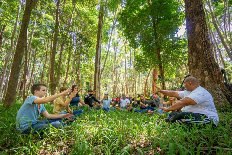 Aloha-Adventure-Farms-group-meditating-in-lush-green-forest
