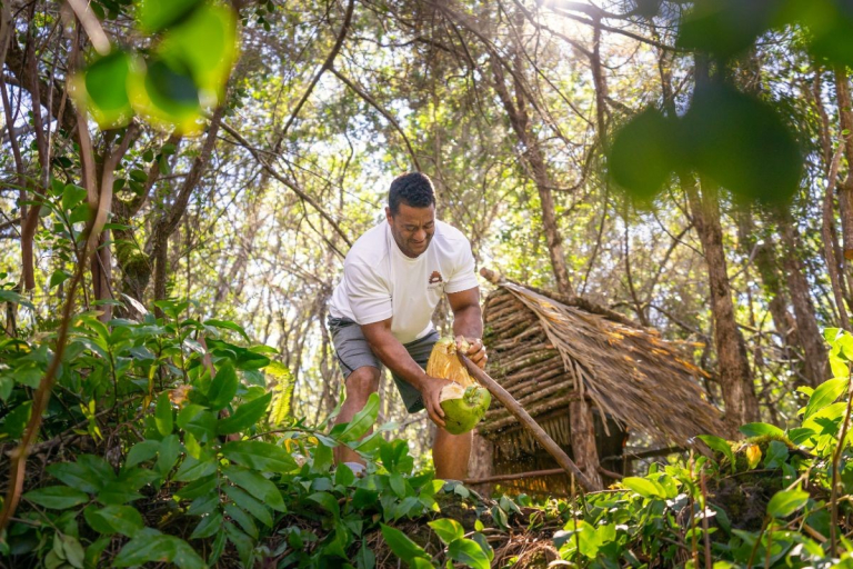 Aloha-Adventure-Farms-man-harvesting-fruit-in-lush-forest