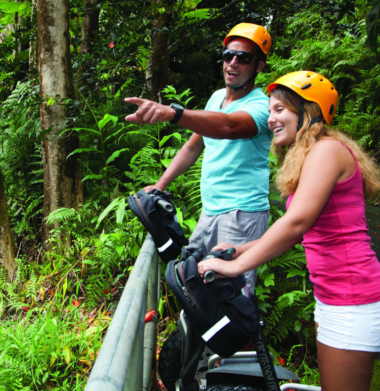 Botanical-World-Adventures-two-people-riding-segways-in-tropical-forest