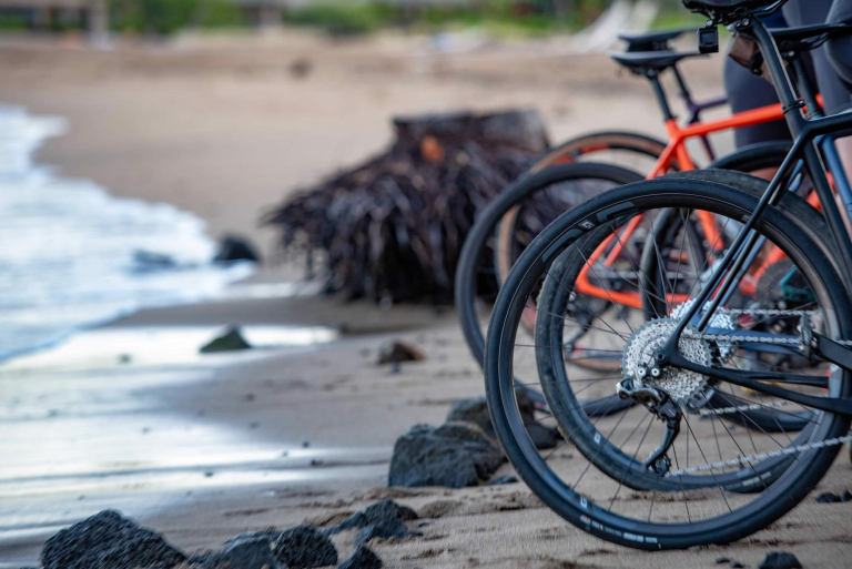 Big Island Bike Tours - bicycles parked on sandy beach near water