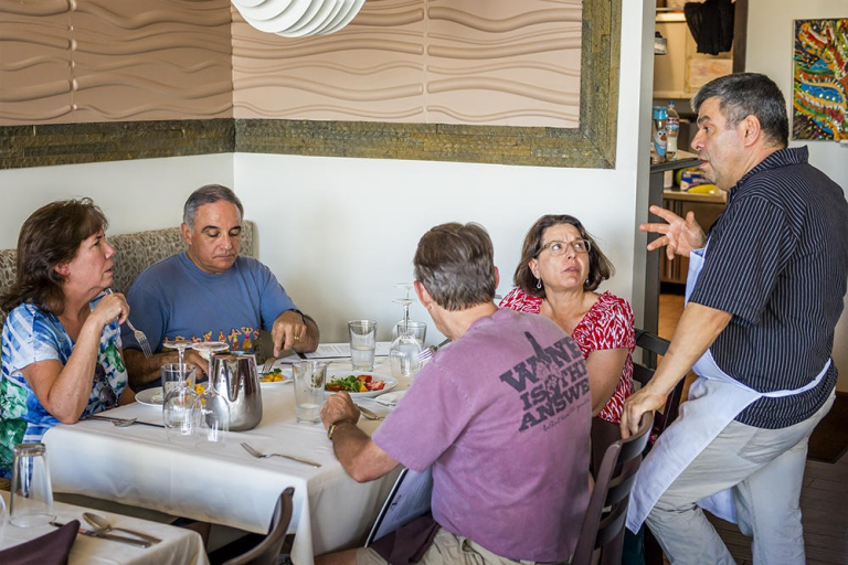 Tasting-Kauai-people-dining-while-waiter-takes-order