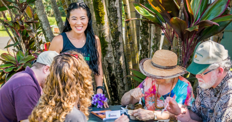 Tasting-Kauai-people-enjoying-outdoor-meal-in-tropical-garden-1
