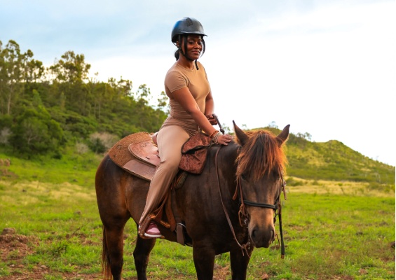 a woman riding a horse